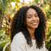 women with coconut oil and hair curls
